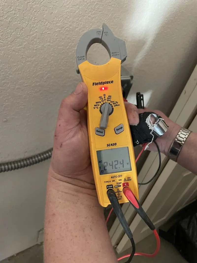 Voltage testing with clamp meter during Generator Installation in Littlefield